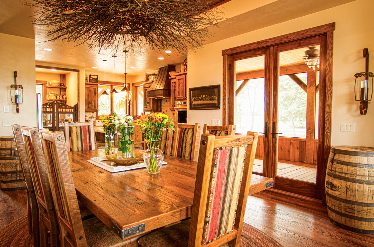 Western dining room with a plank table, striped chairs and twig chandelier, Longhorn Hideaway project, Eastern Wisconsin