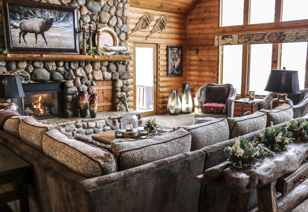 Log home great room with stone fireplace and elk art, Bird’s Eye View project, Northern Wisconsin