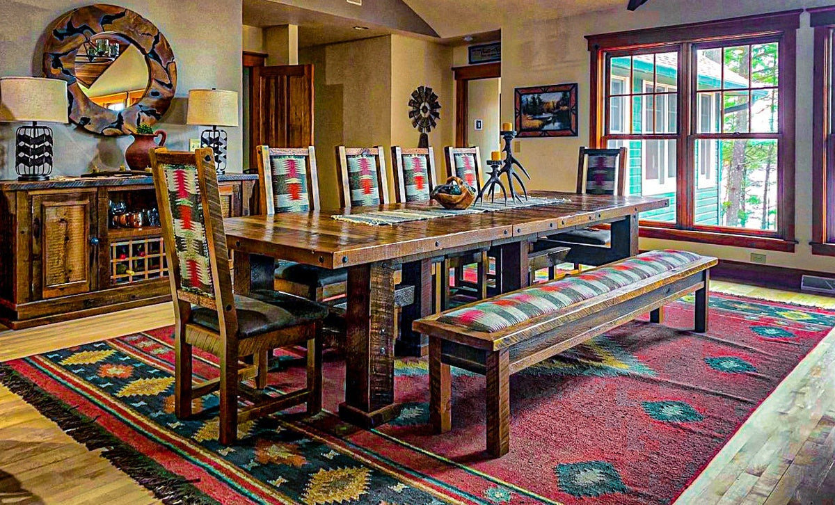 Dining room with a long wood table and a red patterned rug, Moose Hollow project, Northern Wisconsin