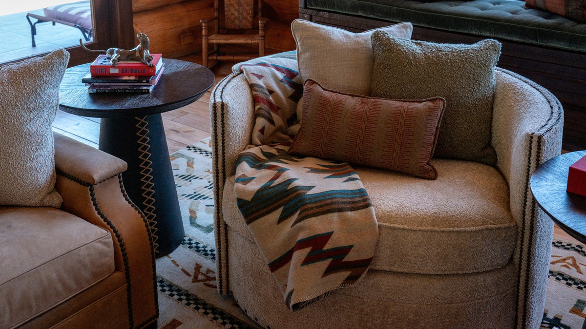 Close-up of a Navajo-pattern throw on a curved chair